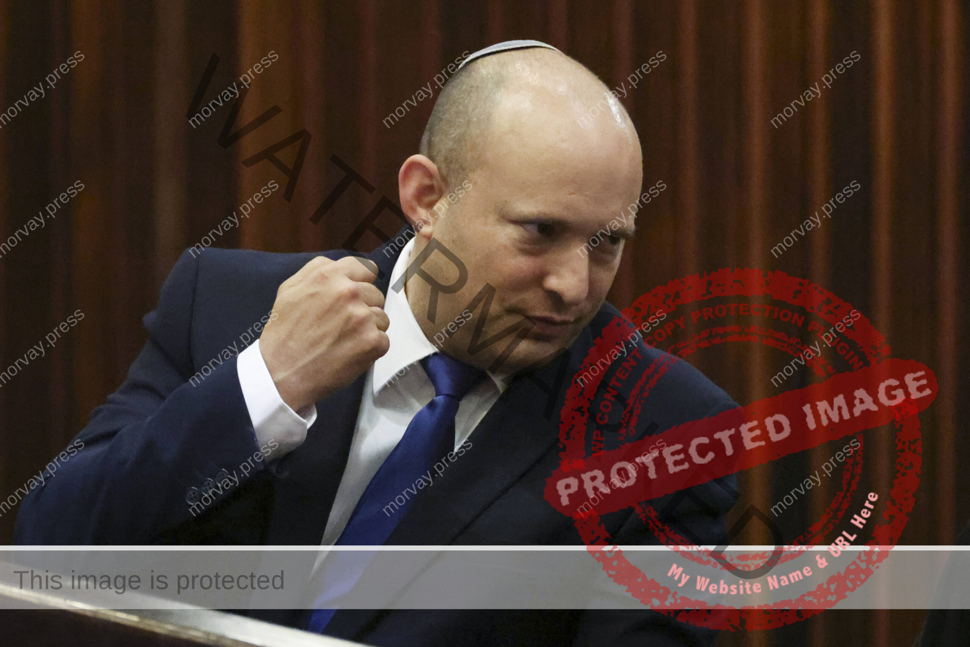 Yamina party leader Naftali Bennett gestures during a special session of the Knesset where Israeli lawmakers elected Is